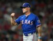 Rangers manager Skip Schumaker gestures on the field during a game against the Angels