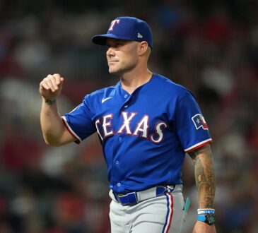 Rangers manager Skip Schumaker gestures on the field during a game against the Angels