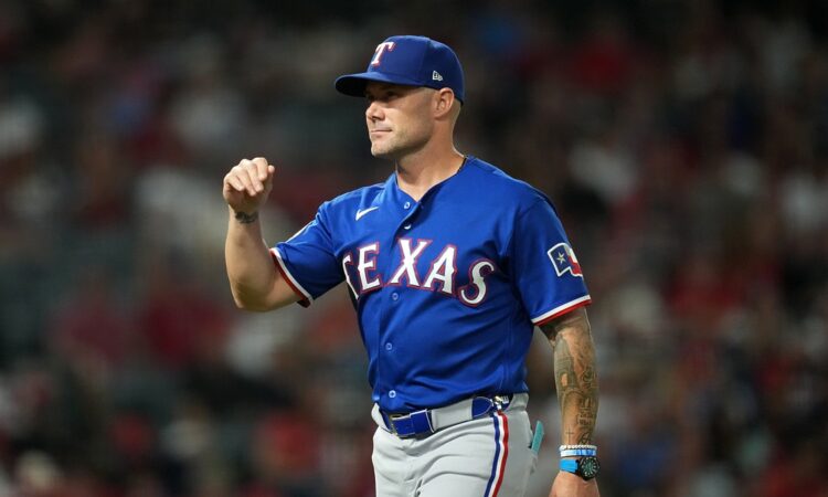 Rangers manager Skip Schumaker gestures on the field during a game against the Angels