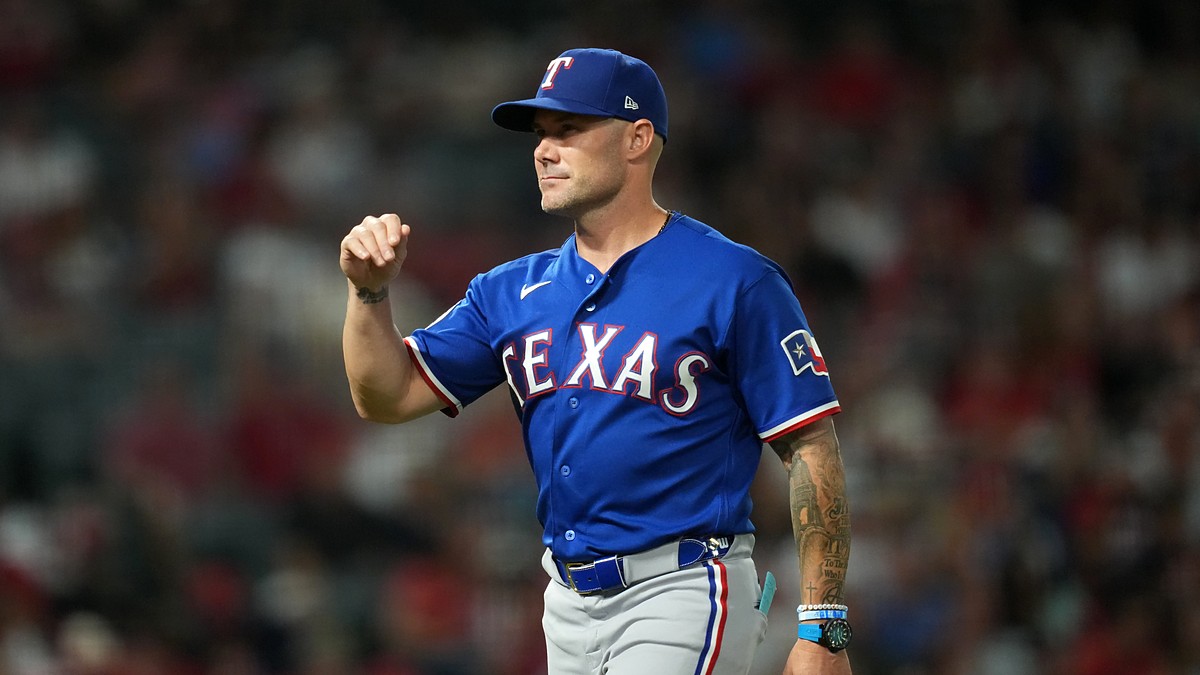 Rangers manager Skip Schumaker gestures on the field during a game against the Angels