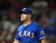 Rangers manager Skip Schumaker gestures on the field during a game against the Angels