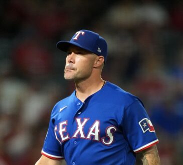 Rangers manager Skip Schumaker gestures on the field during a game against the Angels