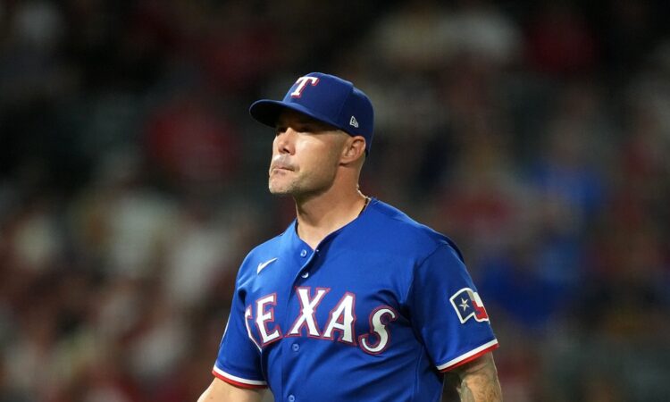 Rangers manager Skip Schumaker gestures on the field during a game against the Angels