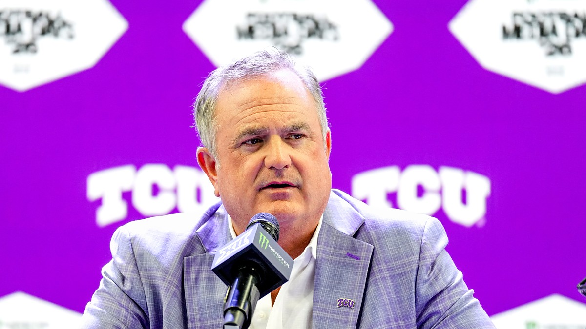 TCU head coach Sonny Dykes speaks into a microphone at a podium during Big 12 media days.