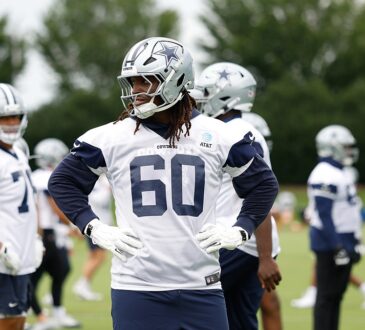 Dallas Cowboys offensive tackle Tyler Guyton stands with his hands on his hips during a minicamp practice.