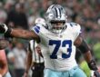 Cowboys guard Tyler Smith extends his arm to block an Eagles defender at the line of scrimmage