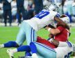 Dallas Cowboys linebacker Tyrus Wheat drives into Arizona Cardinals quarterback Gardner Minshew II as Minshew goes down.