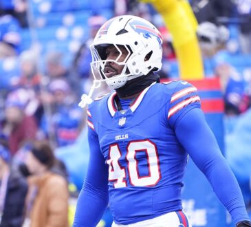 Buffalo Bills linebacker Von Miller stands in his blue No. 40 jersey during warmups before a playoff game.