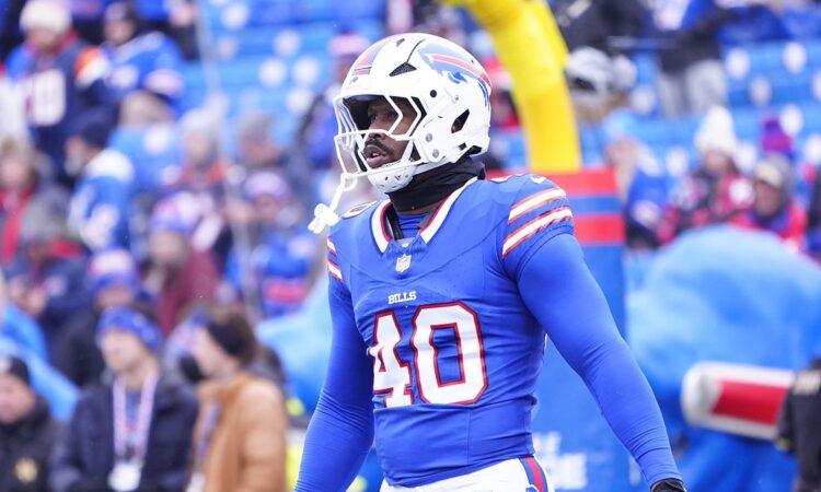 Buffalo Bills linebacker Von Miller stands in his blue No. 40 jersey during warmups before a playoff game.