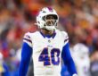 Buffalo Bills linebacker Von Miller looks toward the field in a white No. 40 jersey during the AFC Championship game.