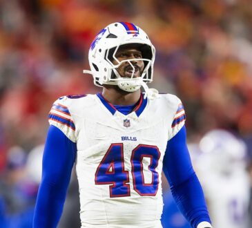 Buffalo Bills linebacker Von Miller looks toward the field in a white No. 40 jersey during the AFC Championship game.