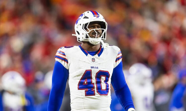 Buffalo Bills linebacker Von Miller looks toward the field in a white No. 40 jersey during the AFC Championship game.