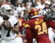 Washington Commanders outside linebacker Von Miller works upfield toward Las Vegas Raiders quarterback Geno Smith as Smith looks to throw.