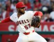 Angels pitcher Walbert Ureña reaches back to deliver a pitch against the Rangers