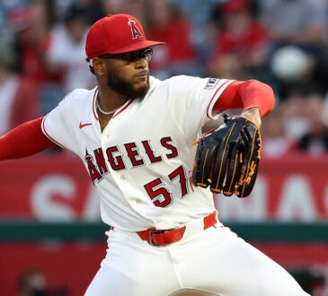 Angels pitcher Walbert Ureña reaches back to deliver a pitch against the Rangers