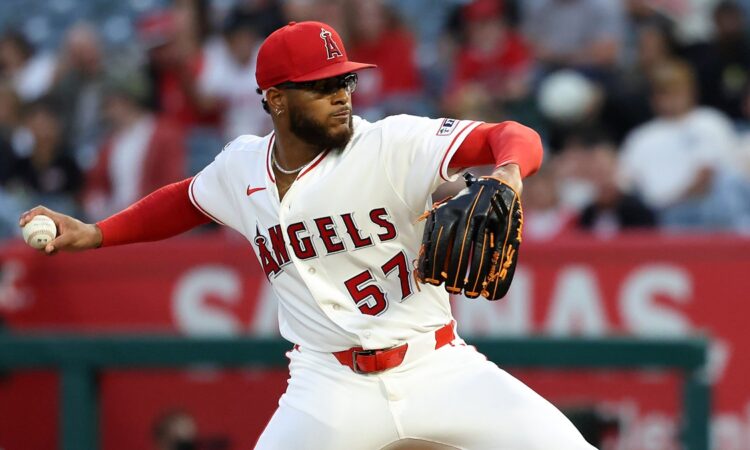 Angels pitcher Walbert Ureña reaches back to deliver a pitch against the Rangers