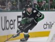 Dallas Stars center Wyatt Johnston skates with the puck along the boards at American Airlines Center.