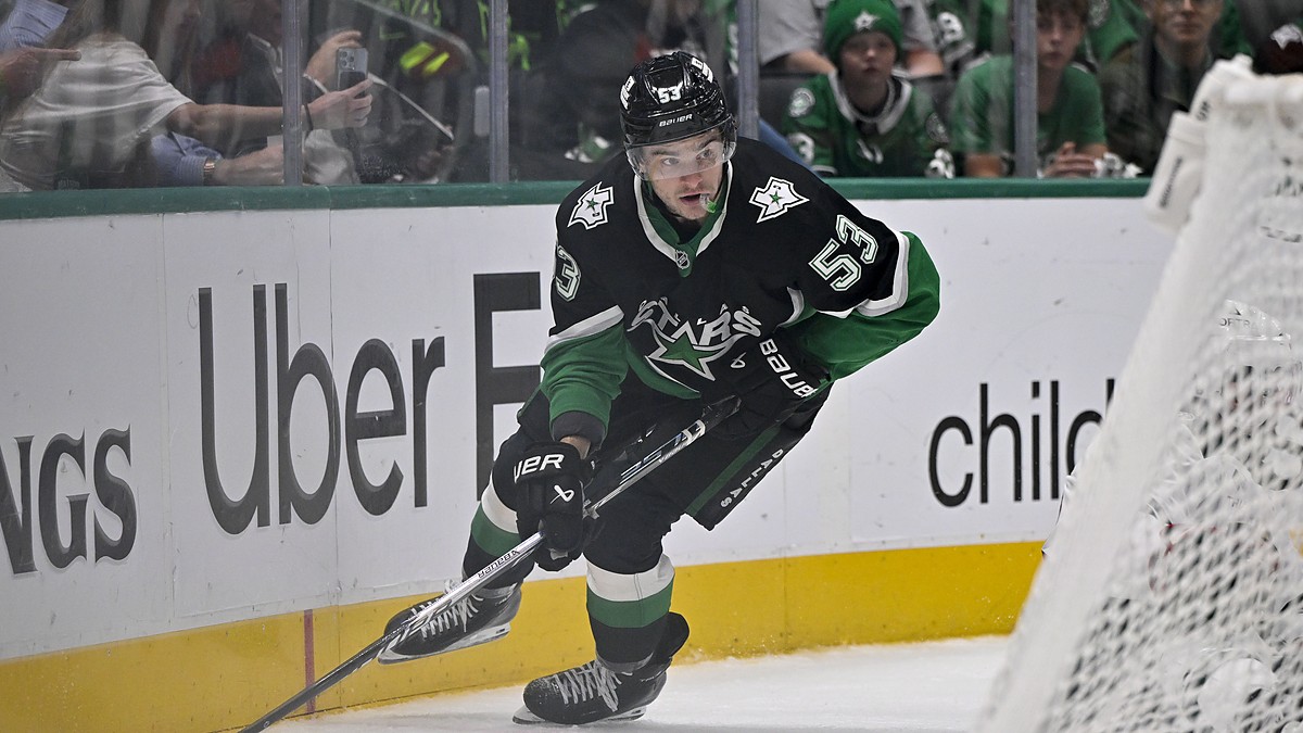 Dallas Stars center Wyatt Johnston skates with the puck along the boards at American Airlines Center.