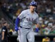 Texas Rangers left fielder Wyatt Langford smiles as he runs up the line after hitting a two-run home run.