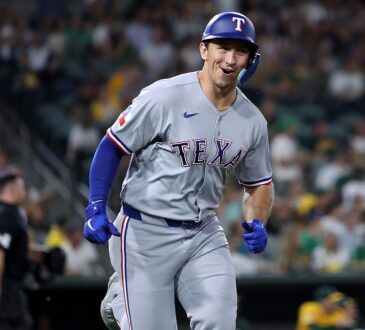 Texas Rangers left fielder Wyatt Langford smiles as he runs up the line after hitting a two-run home run.