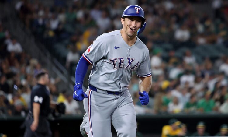 Texas Rangers left fielder Wyatt Langford smiles as he runs up the line after hitting a two-run home run.