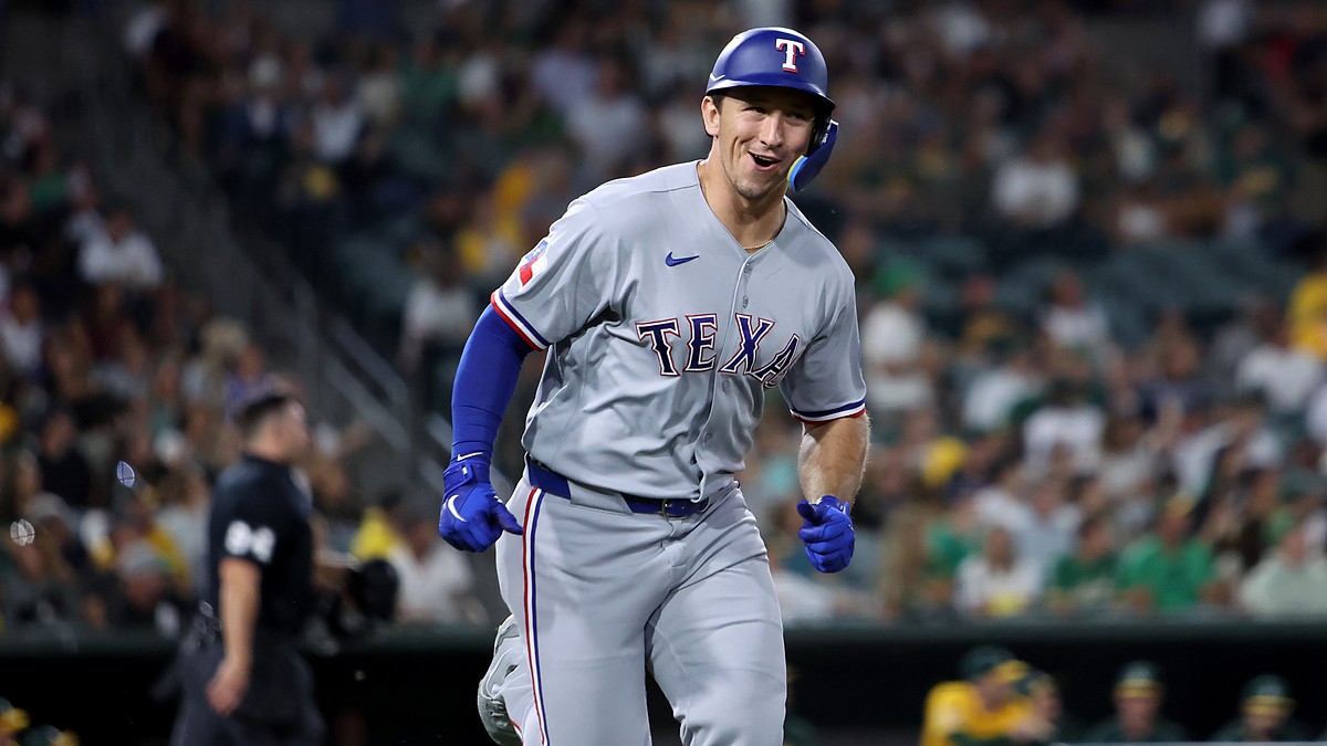 Texas Rangers left fielder Wyatt Langford smiles as he runs up the line after hitting a two-run home run.