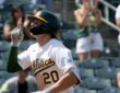 Athletics left fielder Zack Gelof raises an index finger as he runs home after a two-run home run.