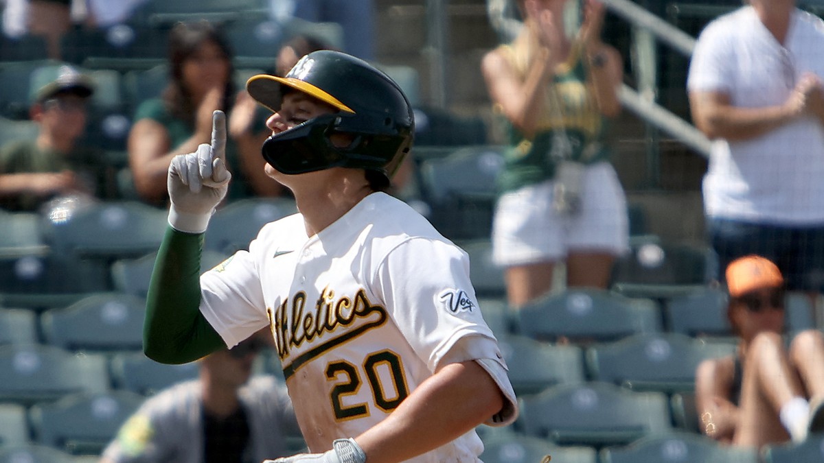 Athletics left fielder Zack Gelof raises an index finger as he runs home after a two-run home run.
