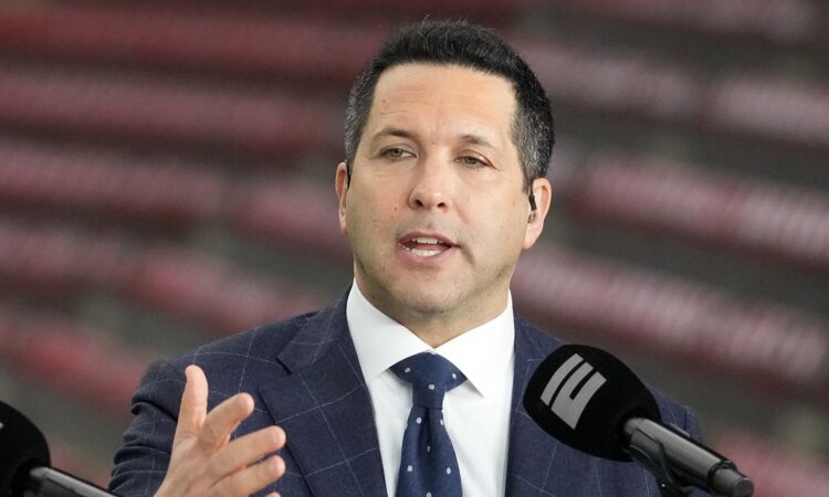 ESPN reporter Adam Schefter speaks on a broadcast set before a college football game at NRG Stadium.