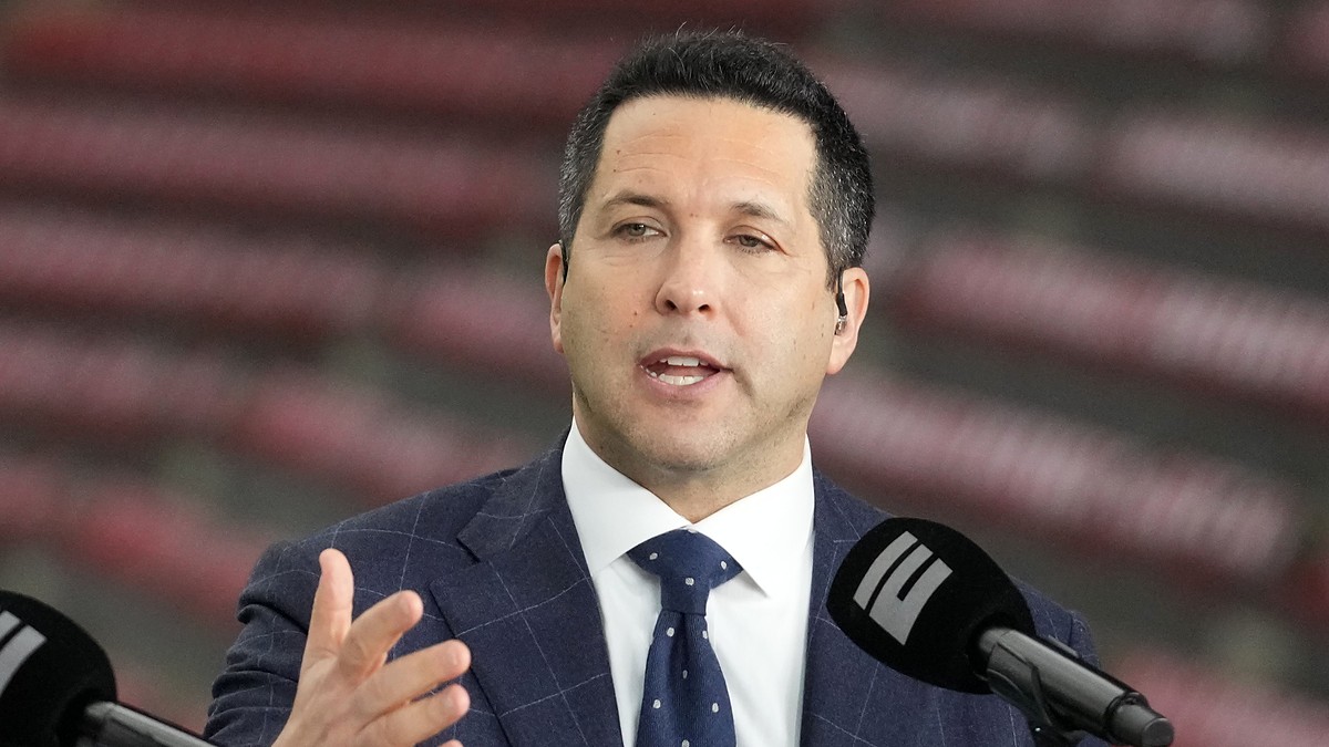 ESPN reporter Adam Schefter speaks on a broadcast set before a college football game at NRG Stadium.