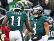 Philadelphia Eagles wide receiver A.J. Brown and quarterback Jalen Hurts celebrate on the field at Lincoln Financial Field.