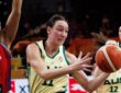 Australia forward Alanna Smith reaches for a loose ball past a Puerto Rico defender in a World Cup group game.