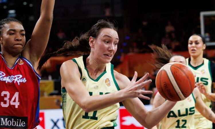 Australia forward Alanna Smith reaches for a loose ball past a Puerto Rico defender in a World Cup group game.