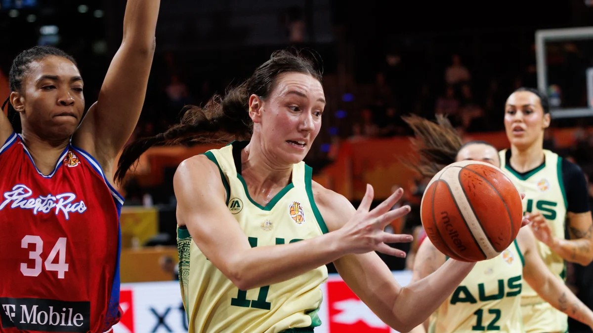 Australia forward Alanna Smith reaches for a loose ball past a Puerto Rico defender in a World Cup group game.