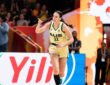 Australia forward Alanna Smith, No. 11, points downcourt while running back after a basket.