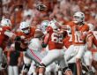 Texas Longhorns quarterback Arch Manning releases a pass from the pocket as linemen block against Ohio State.