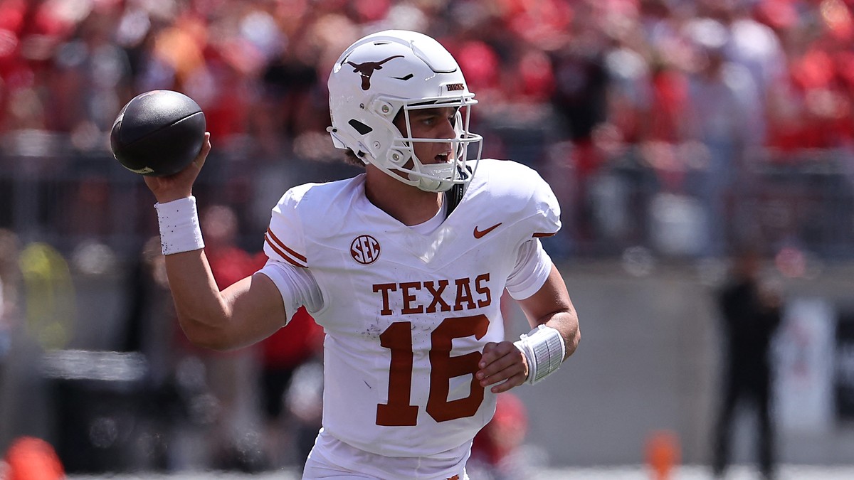 Texas Longhorns quarterback Arch Manning drops back with the ball cocked to throw against Ohio State.