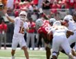 Texas Longhorns quarterback Arch Manning releases a pass as the pocket collapses around him against Ohio State.