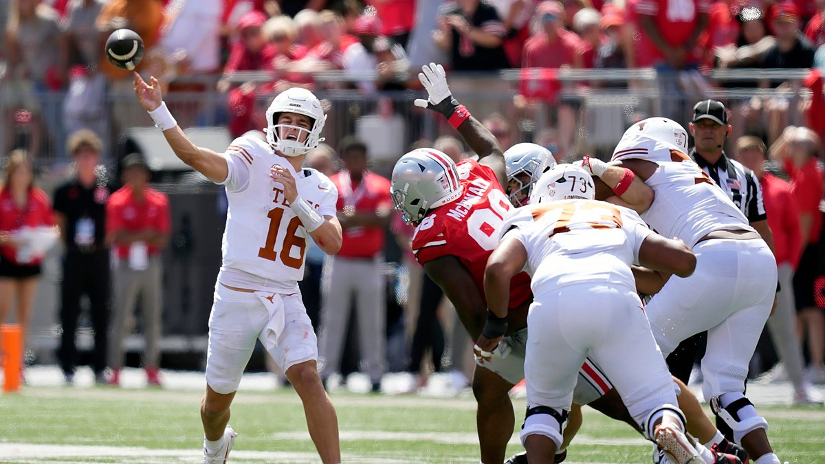 Texas Longhorns quarterback Arch Manning releases a pass as the pocket collapses around him against Ohio State.