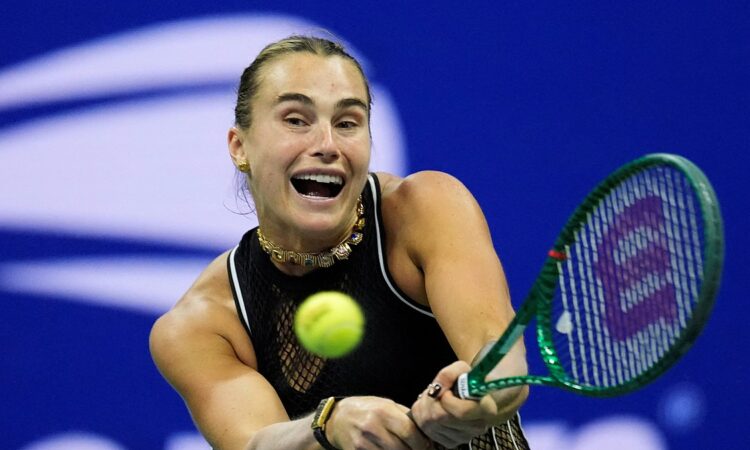 Aryna Sabalenka of Belarus lunges into a two-handed backhand as the ball approaches her racket.