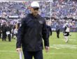 Chicago Bears head coach Ben Johnson walks off the field after a game against the Minnesota Vikings at Soldier Field.