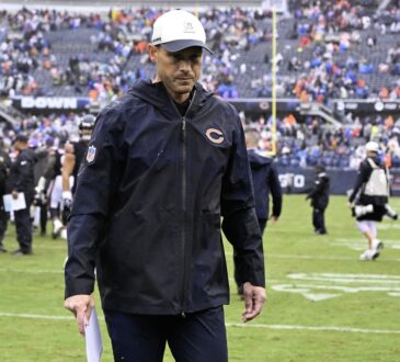 Chicago Bears head coach Ben Johnson walks off the field after a game against the Minnesota Vikings at Soldier Field.