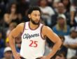 Los Angeles Clippers guard Ben Simmons stands with hands on hips during a game at Golden 1 Center.