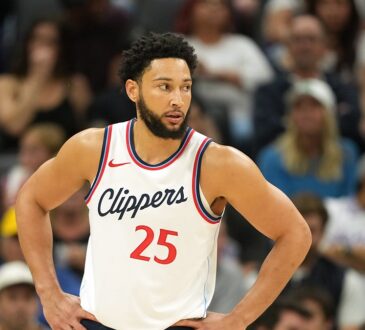 Los Angeles Clippers guard Ben Simmons stands with hands on hips during a game at Golden 1 Center.