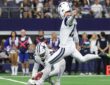 Cowboys placekicker Brandon Aubrey swings through a field goal attempt as punter Bryan Anger holds the ball.