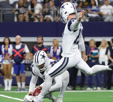 Cowboys placekicker Brandon Aubrey swings through a field goal attempt as punter Bryan Anger holds the ball.