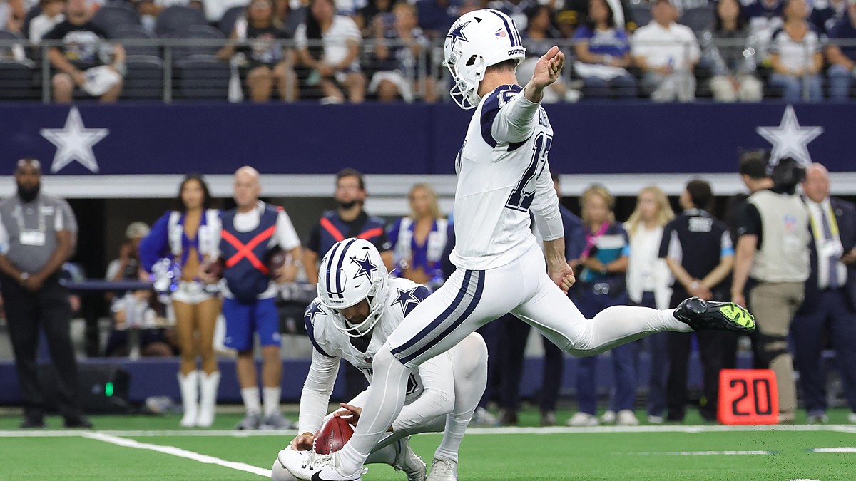 Cowboys placekicker Brandon Aubrey swings through a field goal attempt as punter Bryan Anger holds the ball.