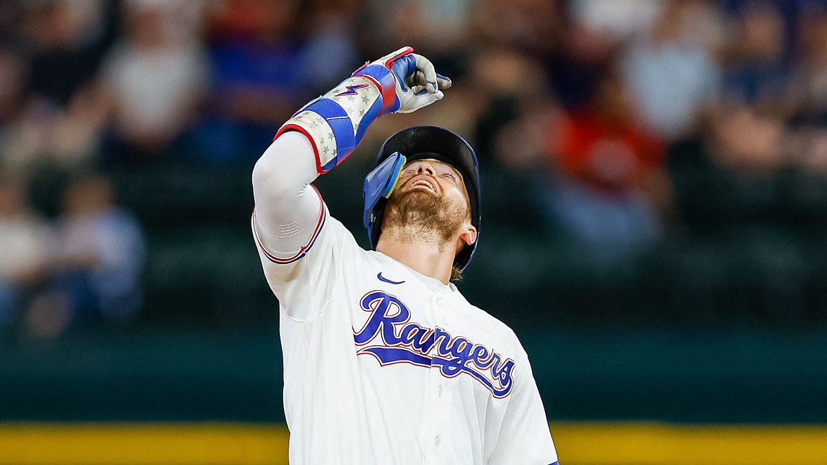 Texas Rangers right fielder Brandon Nimmo points skyward at second base after an RBI double at Globe Life Field.