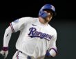 Rangers center fielder Brandon Nimmo runs the bases with his jaw clenched during the seventh inning.