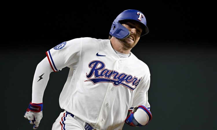 Rangers center fielder Brandon Nimmo runs the bases with his jaw clenched during the seventh inning.